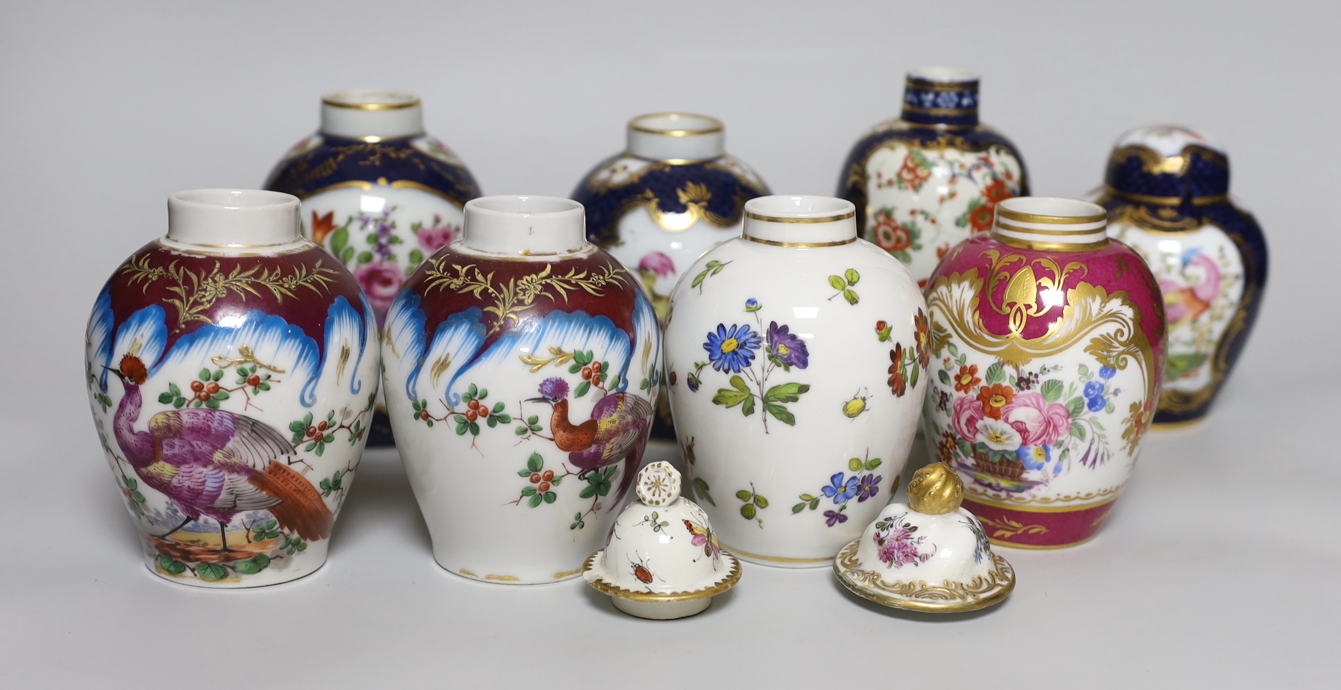 A group of Paris porcelain tea canisters in imitation of Worcester and Sevres, tallest 13.5cm, together with a Worcester Kakiemon pattern scale blue tea canister a/f